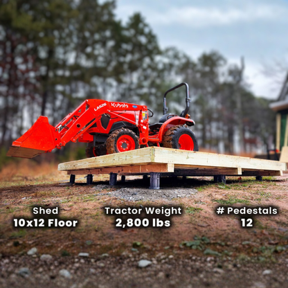 Red tractor on a wooden platform with text indicating shed dimensions, tractor weight, and number of pedestals.